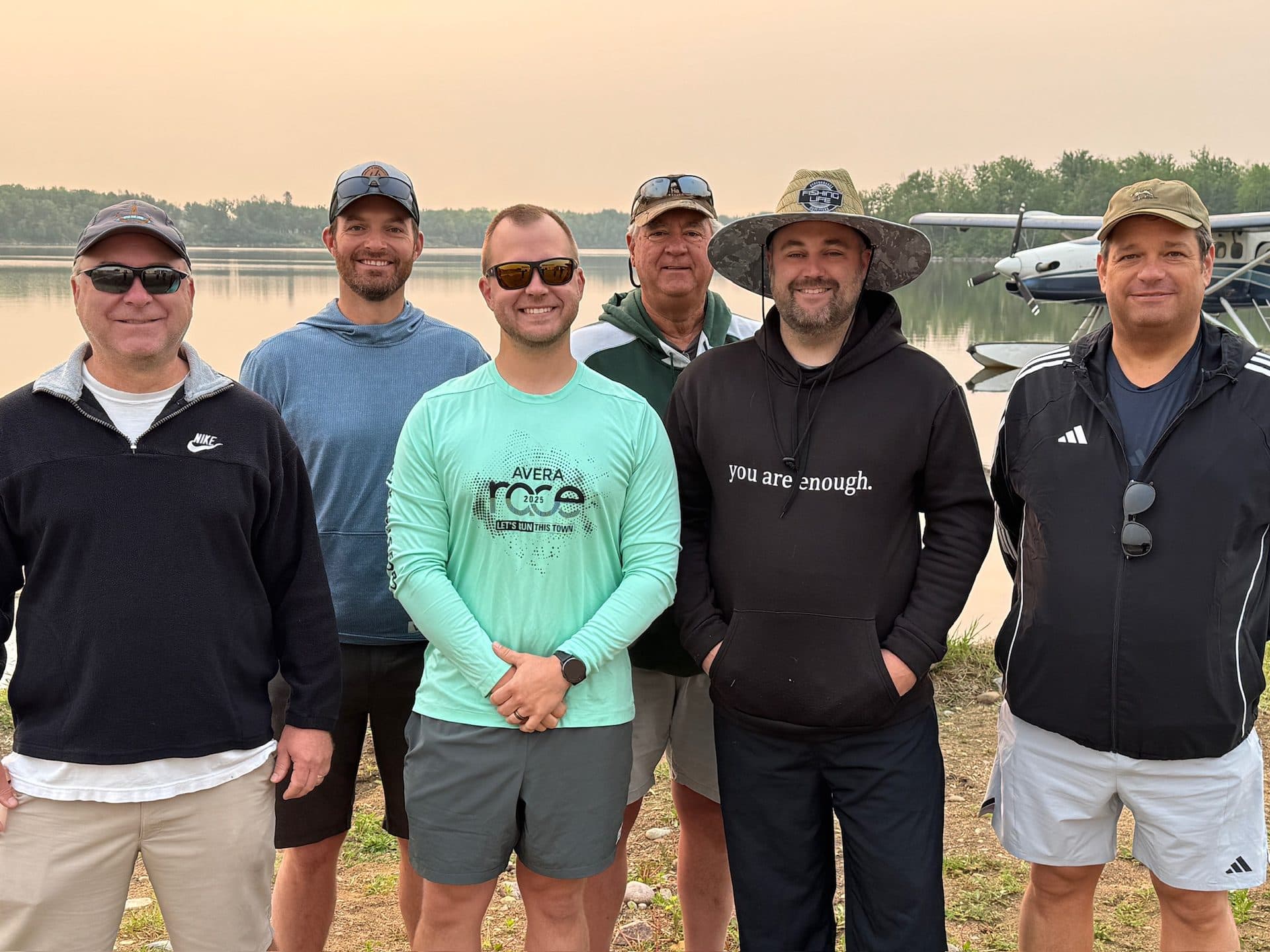 A group of guests at the floatplane dock at Dogskin Lake