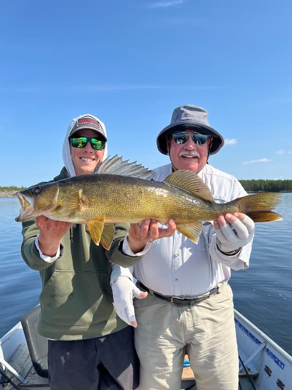 Dogskin Lake Lodge dining room with moose antlers and panoramic lake view