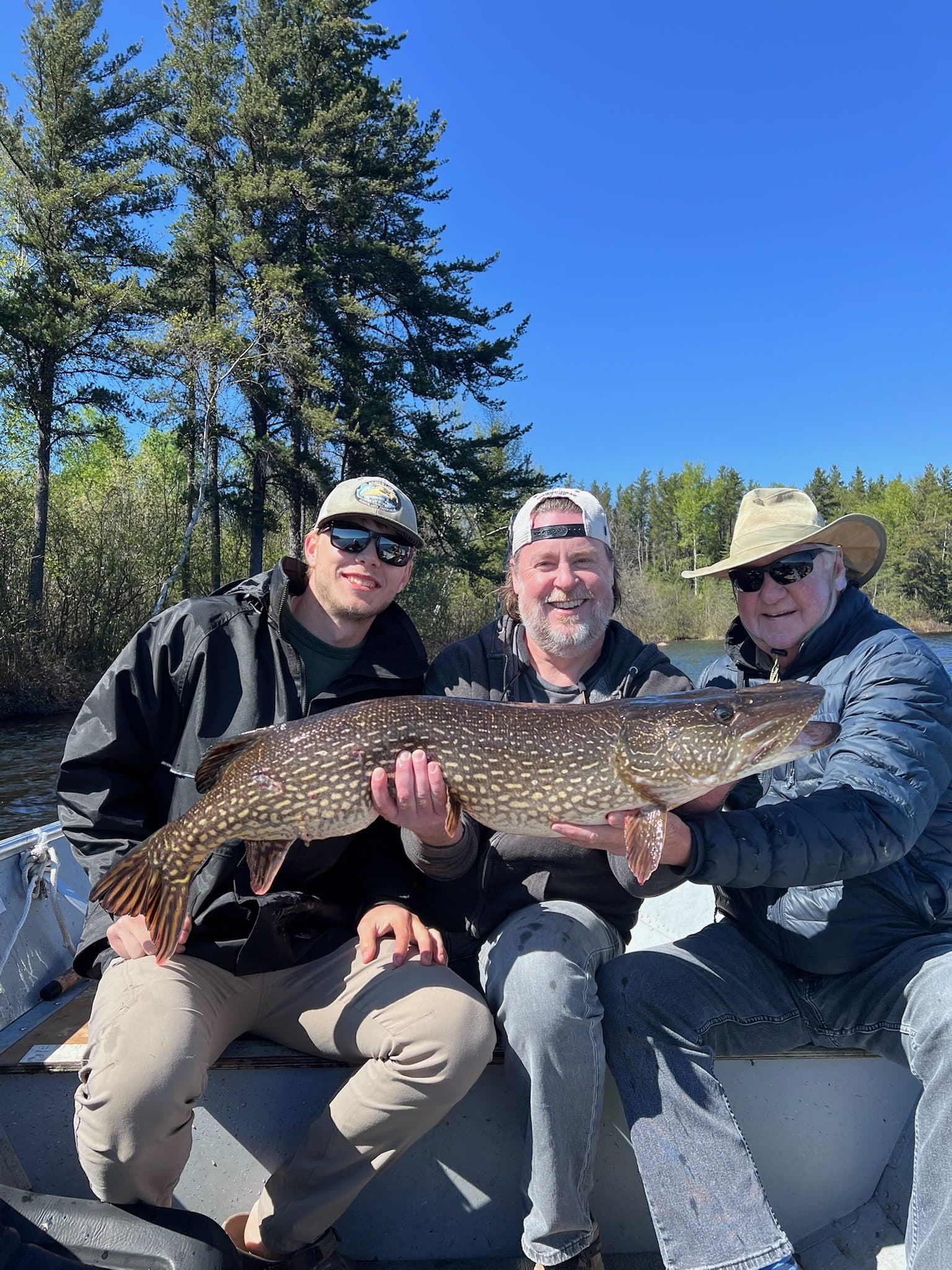 Group with trophy pike
